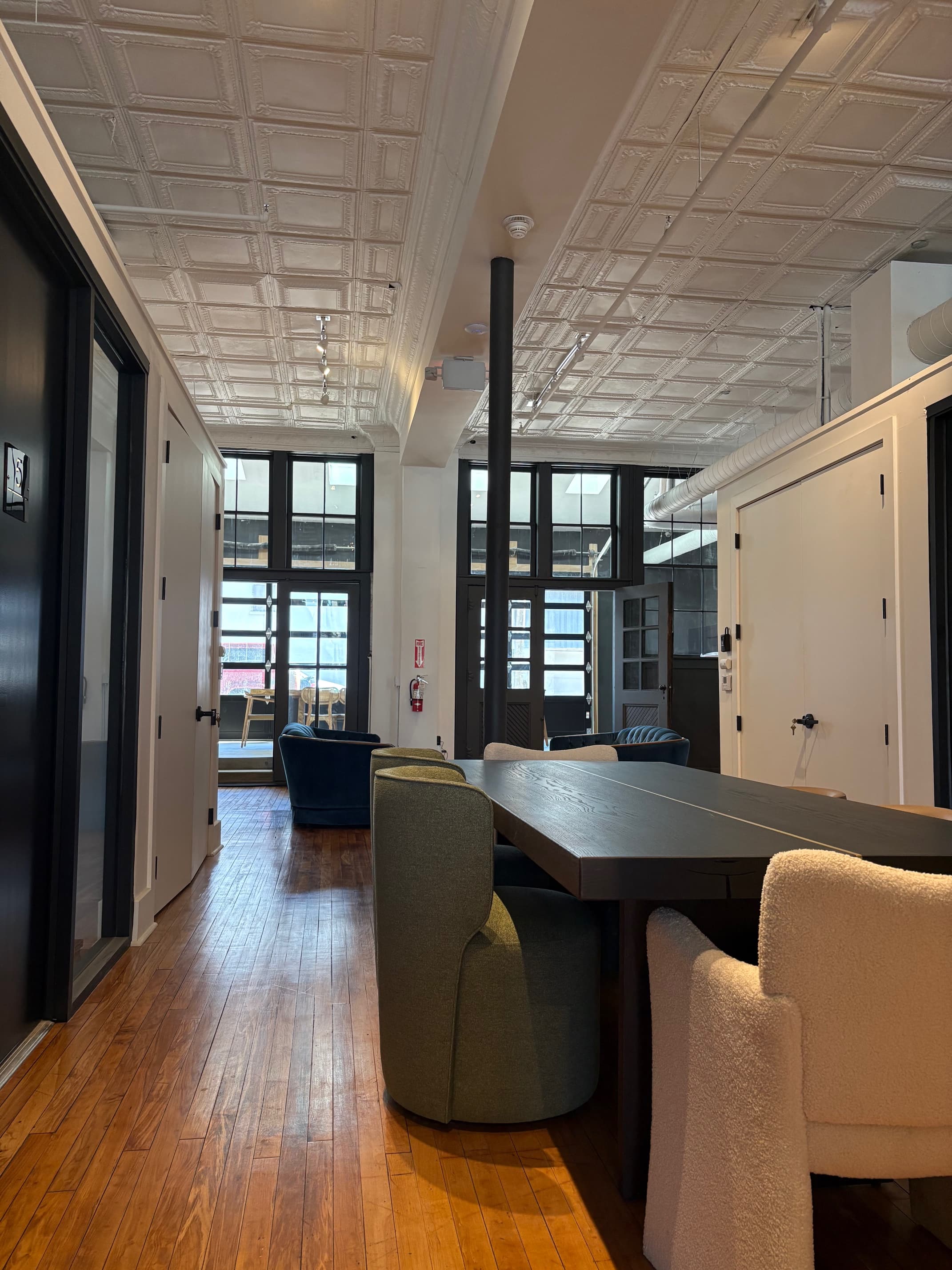 Wide view of the space with seating and offices